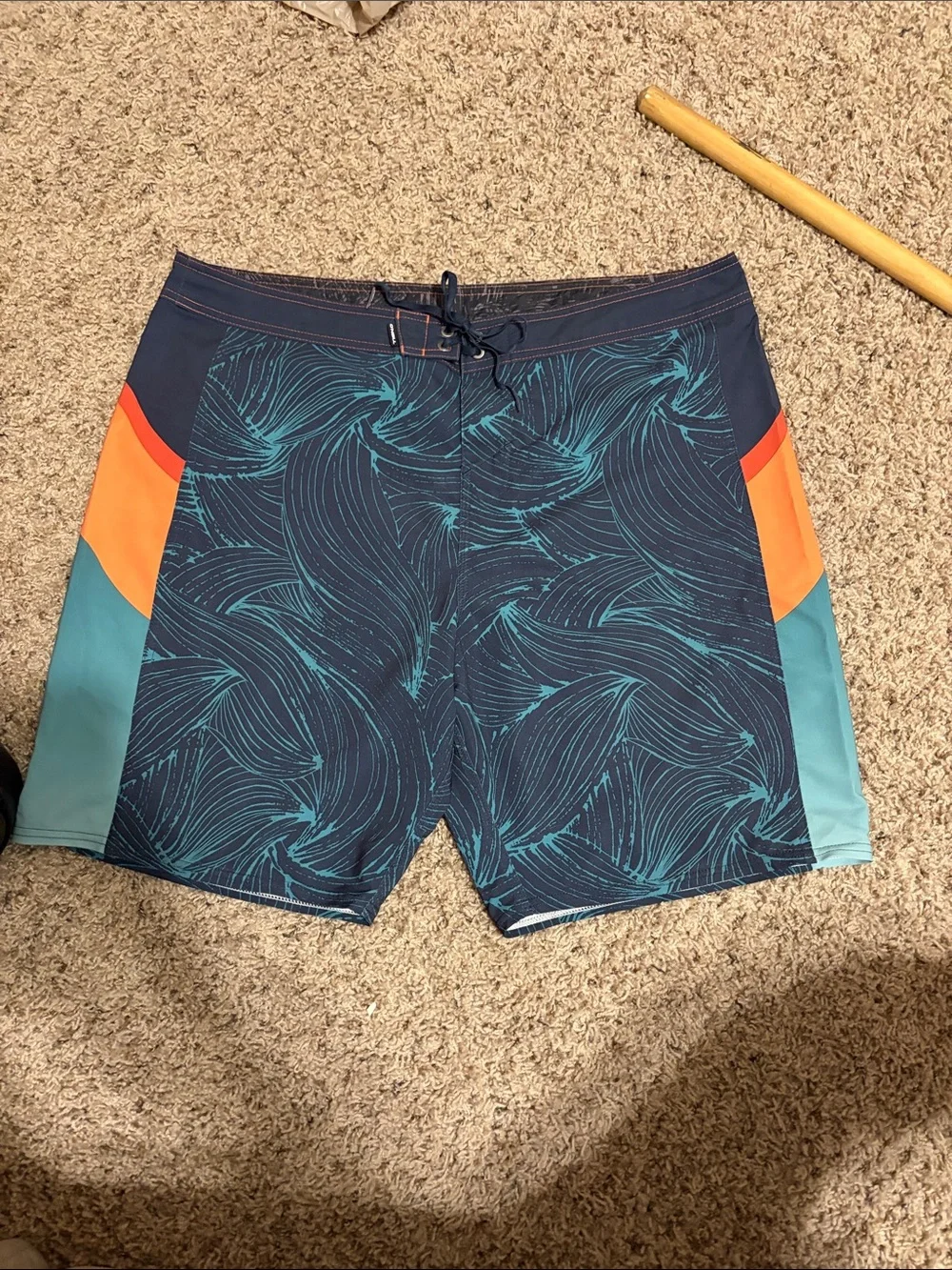 O'Neill Navy Swim Board Shorts with Teal Wave Print and Orange Accents
